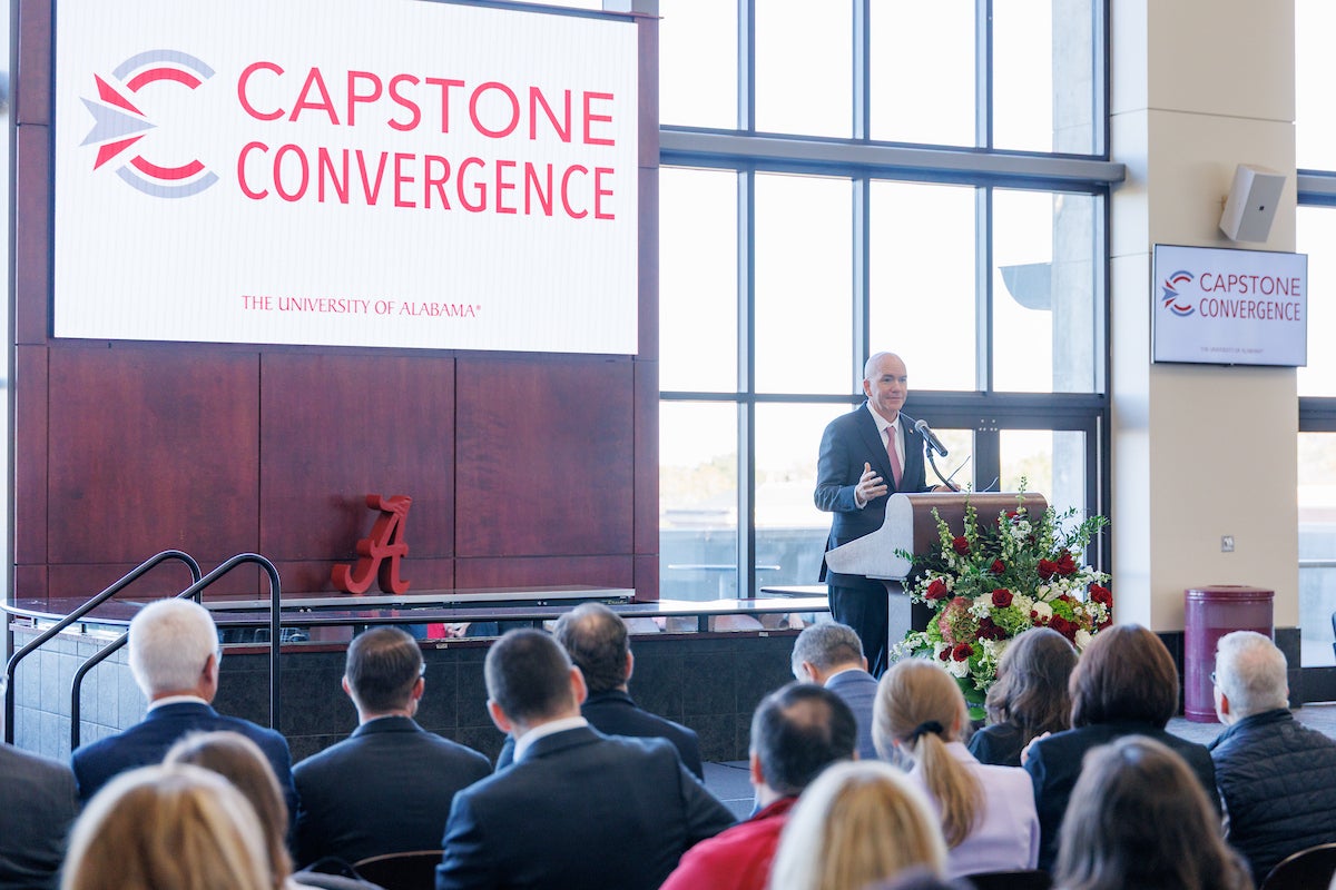 Dr. Peter Mohler speaks at a podium during the Capstone Convergence kickoff event